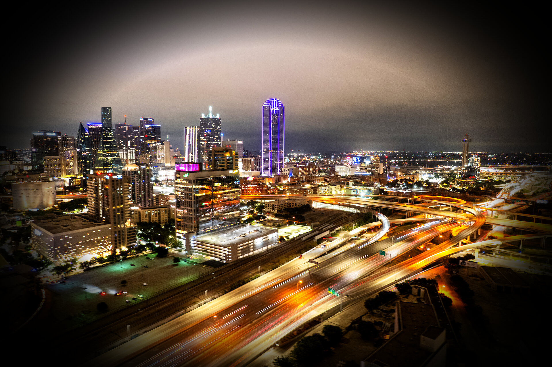 Dallas skyline at night with light trails